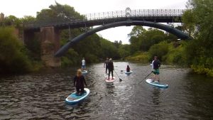 Stand up paddle boarding on the river