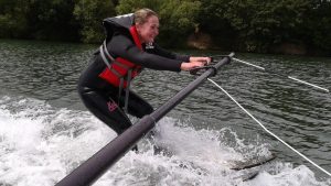 Female water skiier on training beam